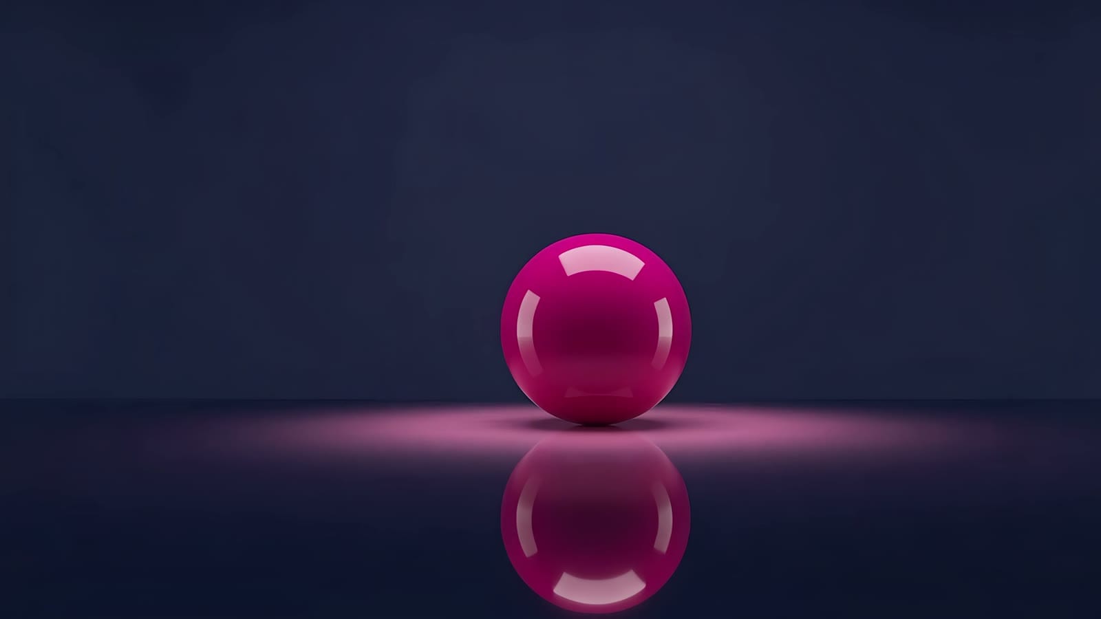 A glossy magenta ball on a dark glass floor